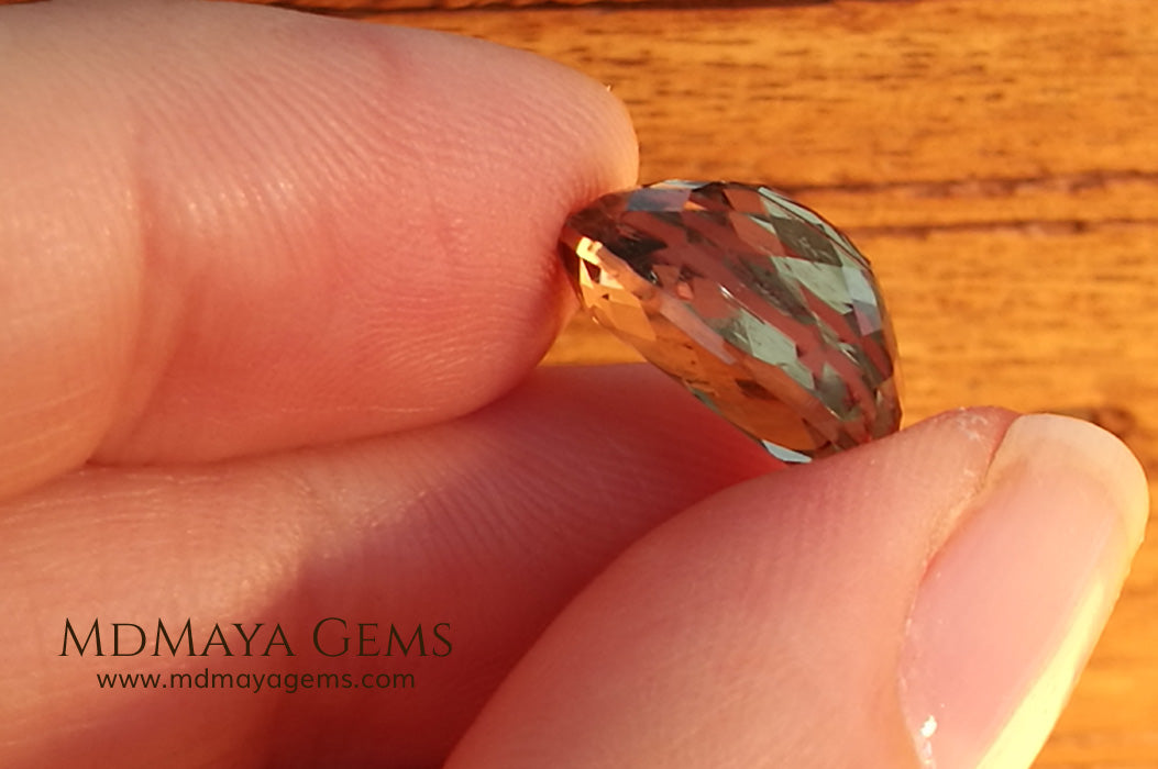 Color Change Diaspore Gemstone 7.68 ct under different lighting conditions