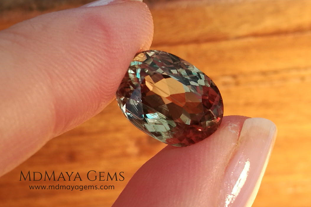 Color Change Diaspore Gemstone 7.68 ct under different lighting conditions