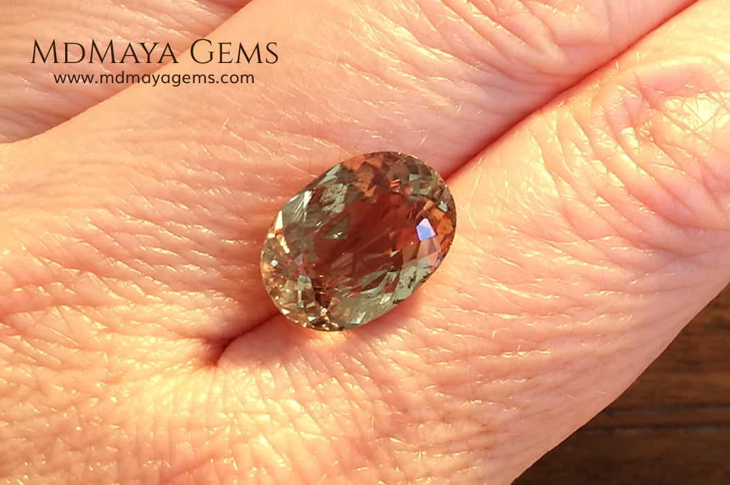 Color Change Diaspore Gemstone 7.68 ct under different lighting conditions