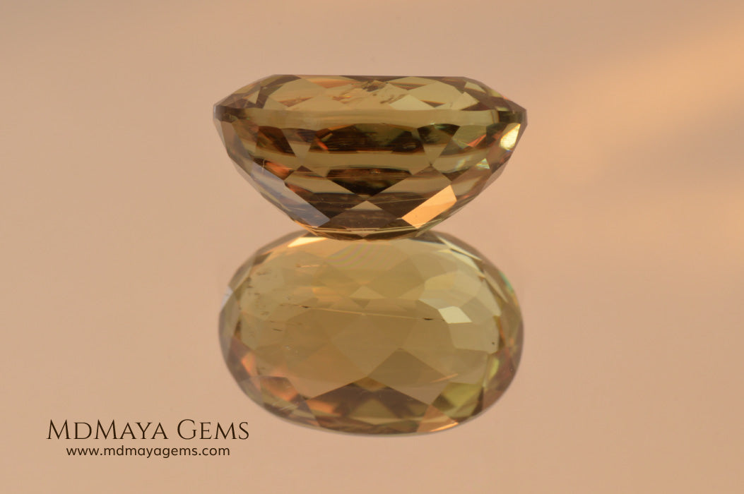 Color Change Diaspore Gemstone 7.68 ct under different lighting conditions