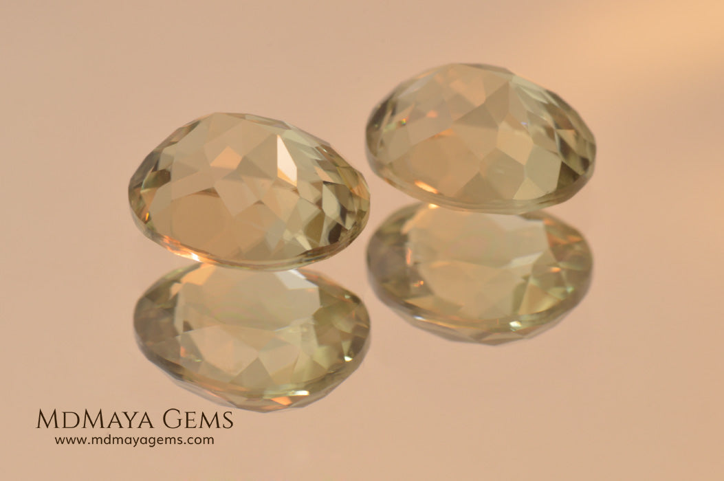Color Change Diaspore Gemstone 3.99 ct pair under different lighting conditions