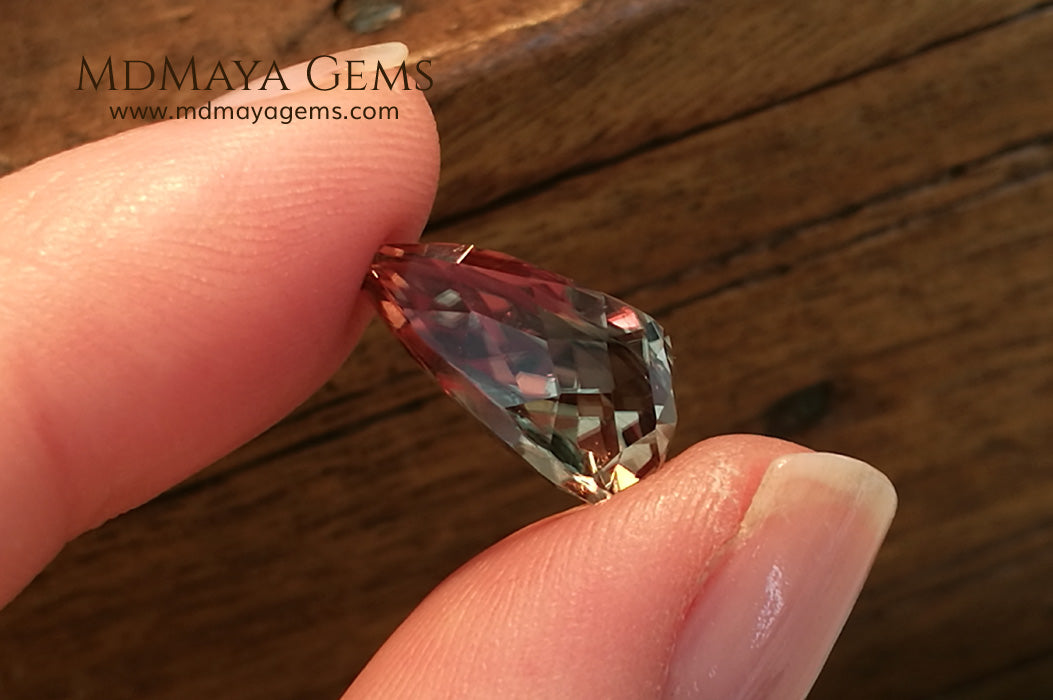 Color Change Diaspore Gemstone 7.77 ct under different lighting conditions