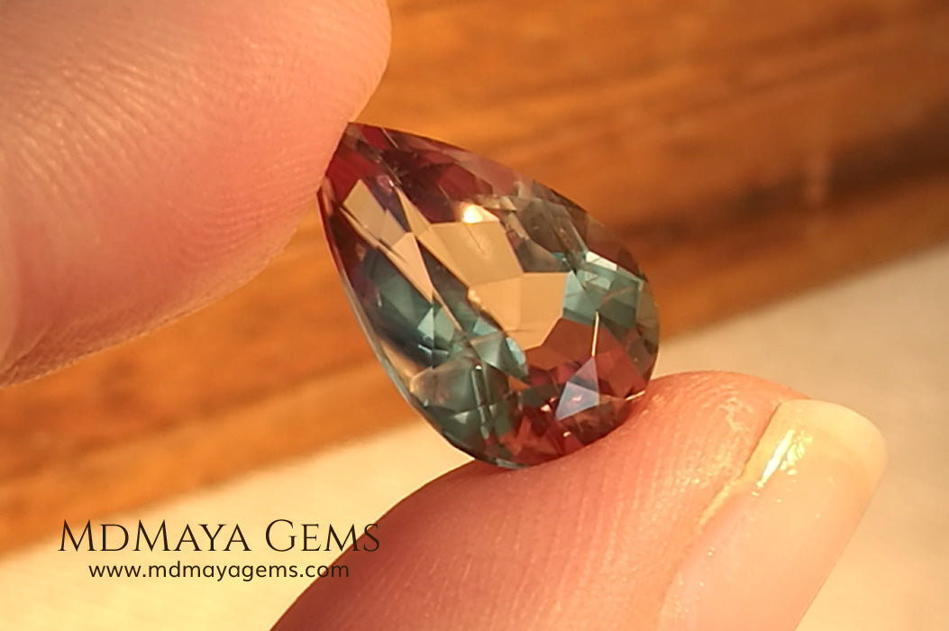 Color Change Diaspore Gemstone 7.77 ct under different lighting conditions