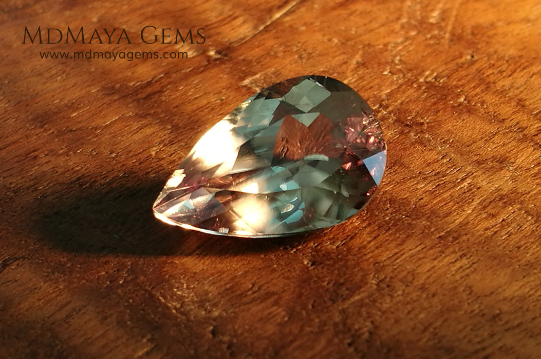 Color Change Diaspore Gemstone 7.77 ct under different lighting conditions