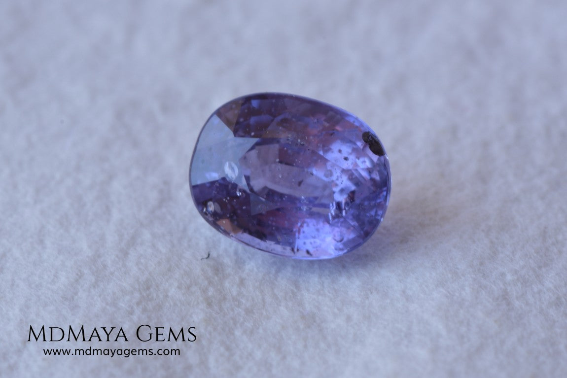  Change Color Sapphire, Oval Cut 1.38 ct. This amazing gemstone is violet in daylight and purple under incandescent light. Its color is very bright and vivid, it will look very interesting in any piece of jewelry, and the best, the price.