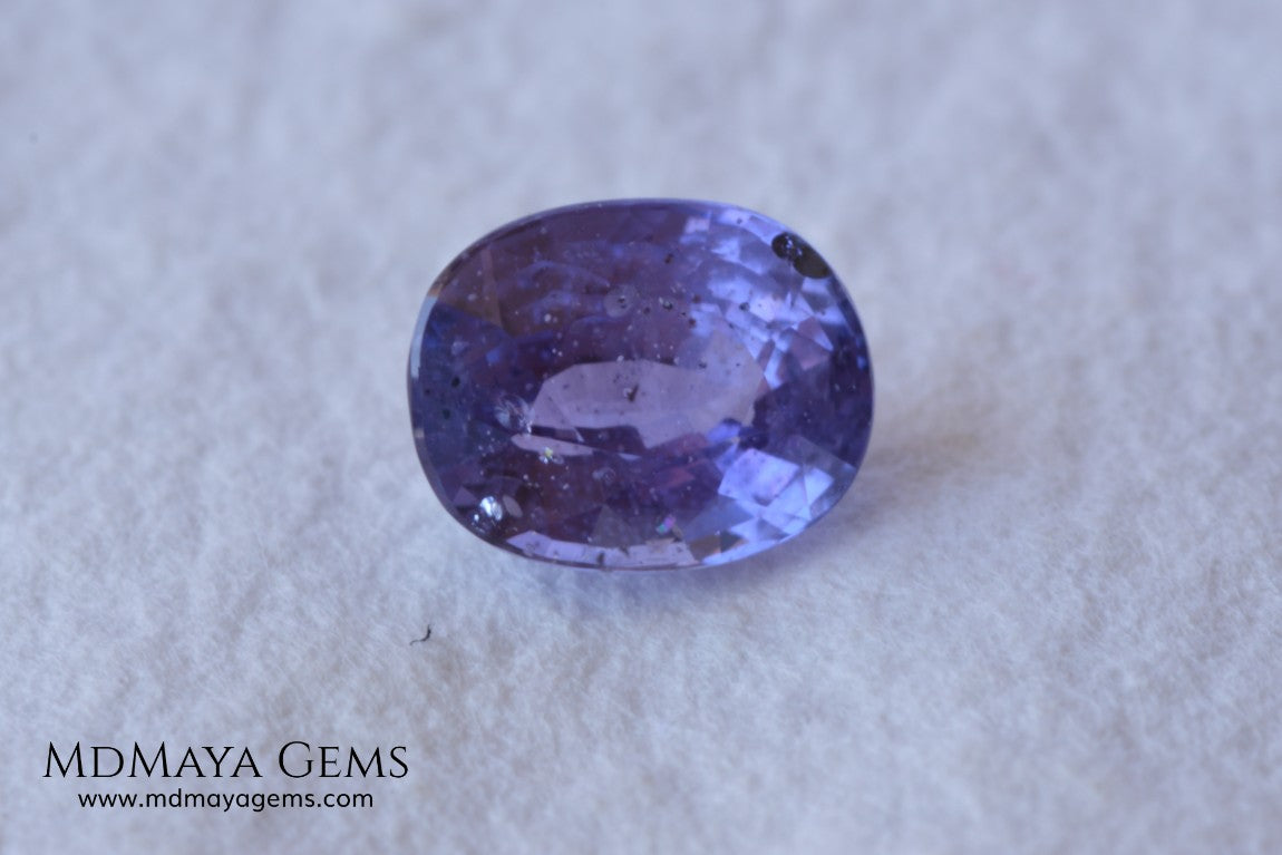  Change Color Sapphire, Oval Cut 1.38 ct. This amazing gemstone is violet in daylight and purple under incandescent light. Its color is very bright and vivid, it will look very interesting in any piece of jewelry, and the best, the price.