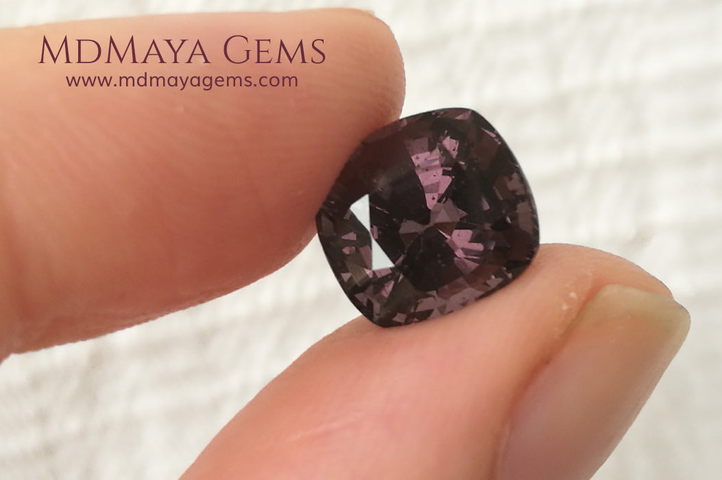 Large dark grayish reddish purple Spinel 5.30 ct under daylight