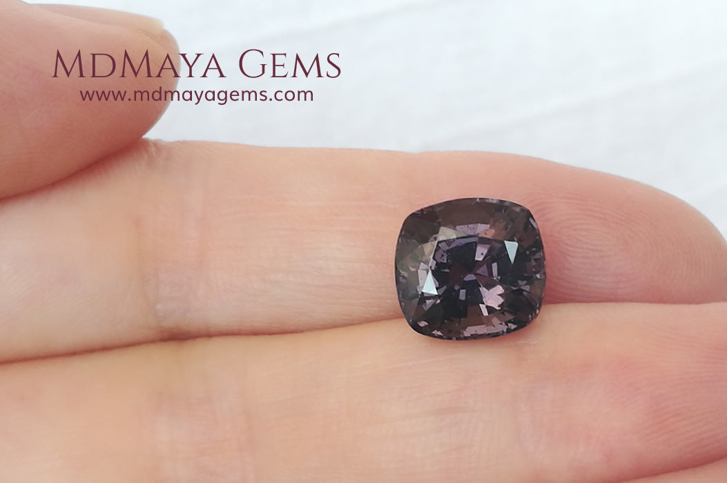 Large dark grayish reddish purple Spinel 5.30 ct under daylight