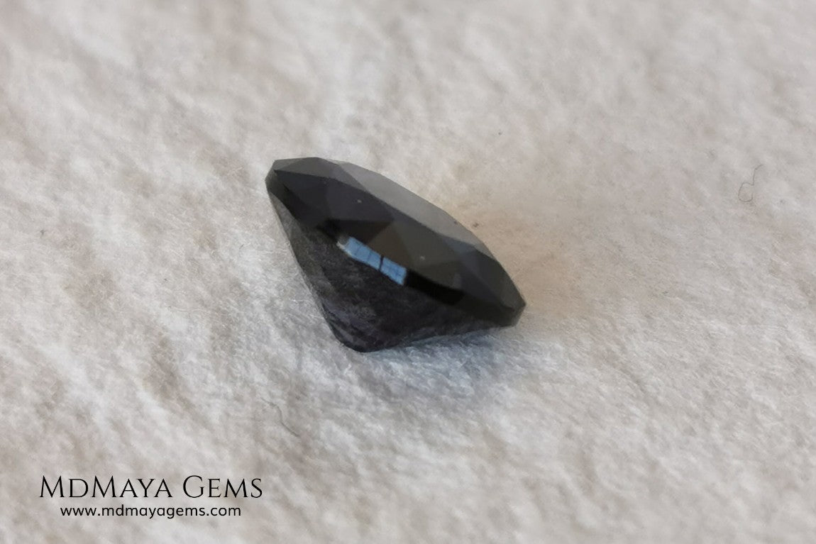 Dark Violet Spinel, 2.10 ct, oval cut. This dark gemstone has magnificent behavior under different light, under incandescent light, blue and purple sparkles are seen in it, making it very attractive. If you like different gems, you will like this one. Perfect for your custom jewelry.