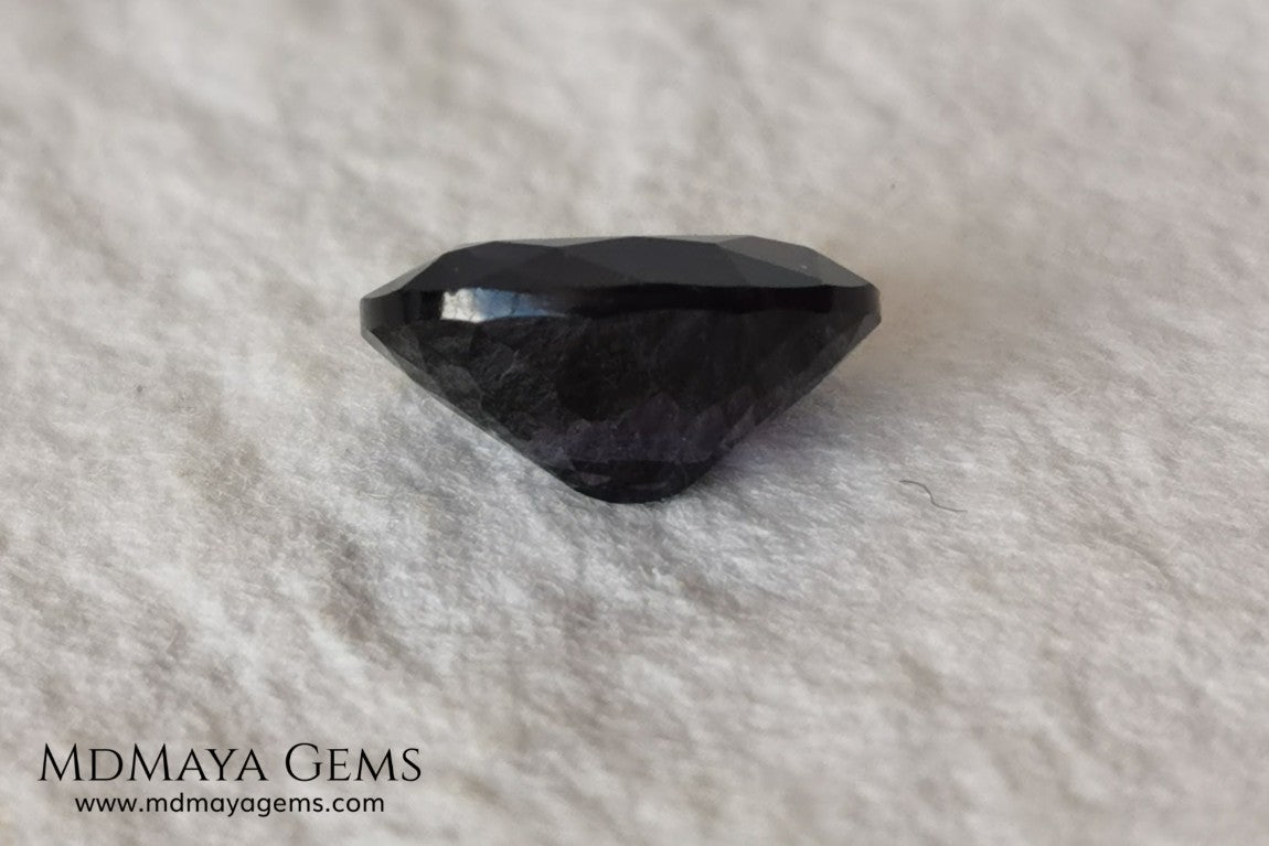 Dark Violet Spinel, 2.10 ct, oval cut. This dark gemstone has magnificent behavior under different light, under incandescent light, blue and purple sparkles are seen in it, making it very attractive. If you like different gems, you will like this one. Perfect for your custom jewelry.