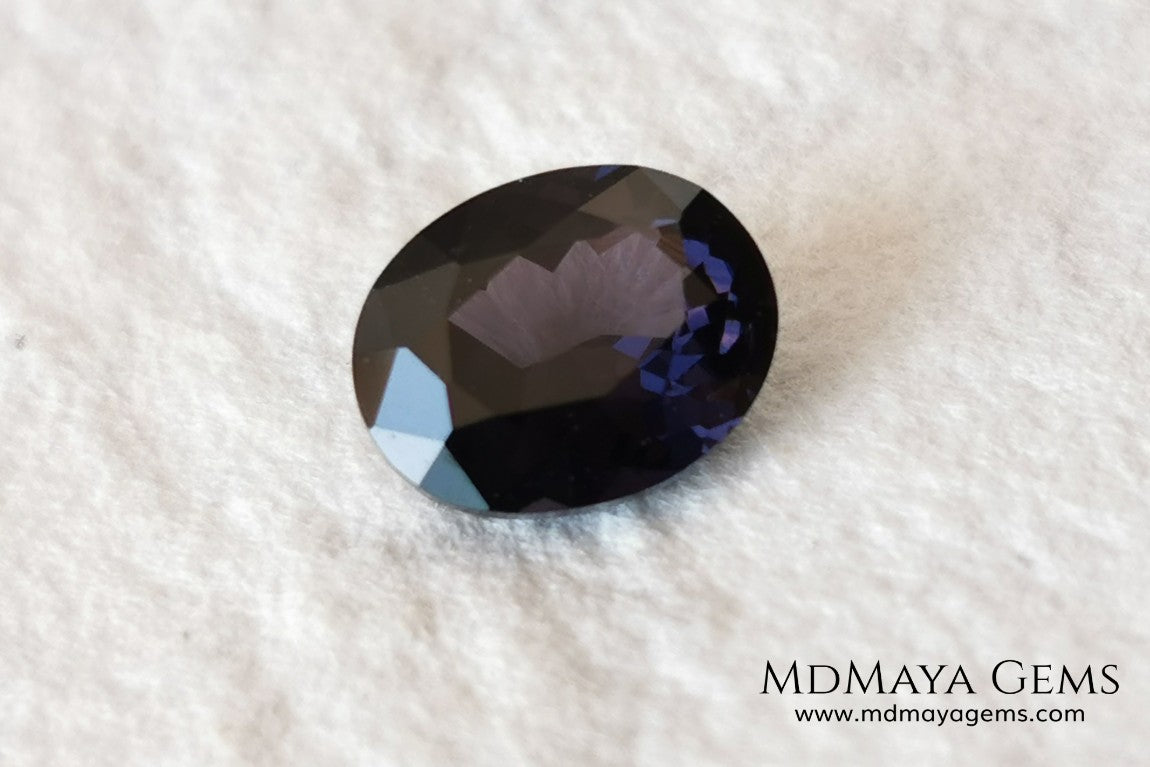 Dark Violet Spinel, 2.10 ct, oval cut. This dark gemstone has magnificent behavior under different light, under incandescent light, blue and purple sparkles are seen in it, making it very attractive. If you like different gems, you will like this one. Perfect for your custom jewelry.