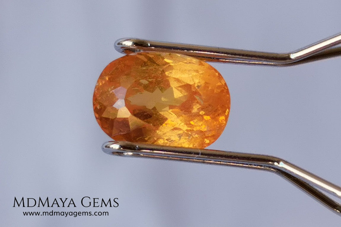  Fanta Unheated Spessartite Garnet. Oval Cut. 2.17 ct. This gemstone has a pure orange, without brown or reddish tones, it is rare for a gem to have such a pure color, and it is simply impressive. It has inclusions that do not affect the beauty of the gem at all. It will be incredibly beautiful mounted on any piece of jewelry, it will be the center of attention.