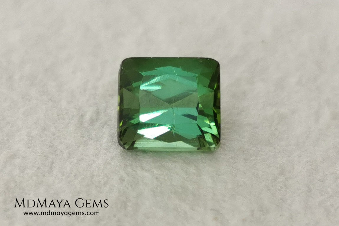 Bright Yellowish Green Tourmaline. 1.26 ct. Rectangular, scissor cut. This beautiful and natural green gemstone shows a vivid and bright color, its behavior under any kind of light is wonderful, always plenty of life and color. It will look perfect in a ring. Low price.