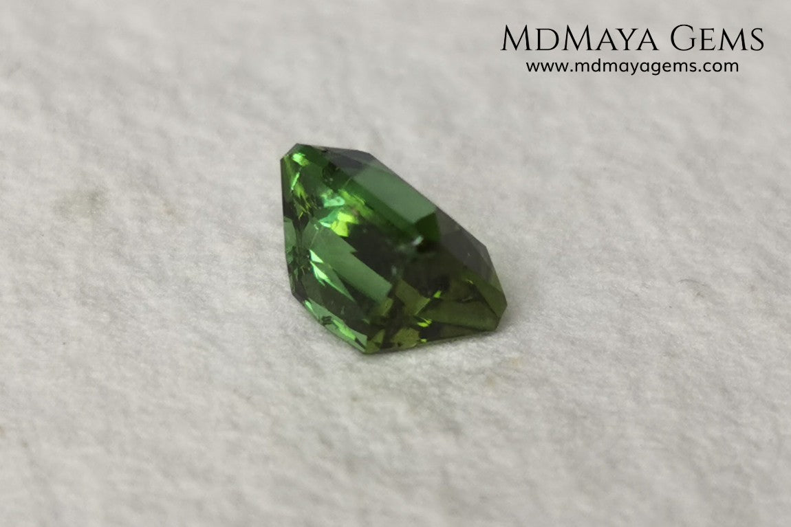 Bright Yellowish Green Tourmaline. 1.26 ct. Rectangular, scissor cut. This beautiful and natural green gemstone shows a vivid and bright color, its behavior under any kind of light is wonderful, always plenty of life and color. It will look perfect in a ring. Low price.