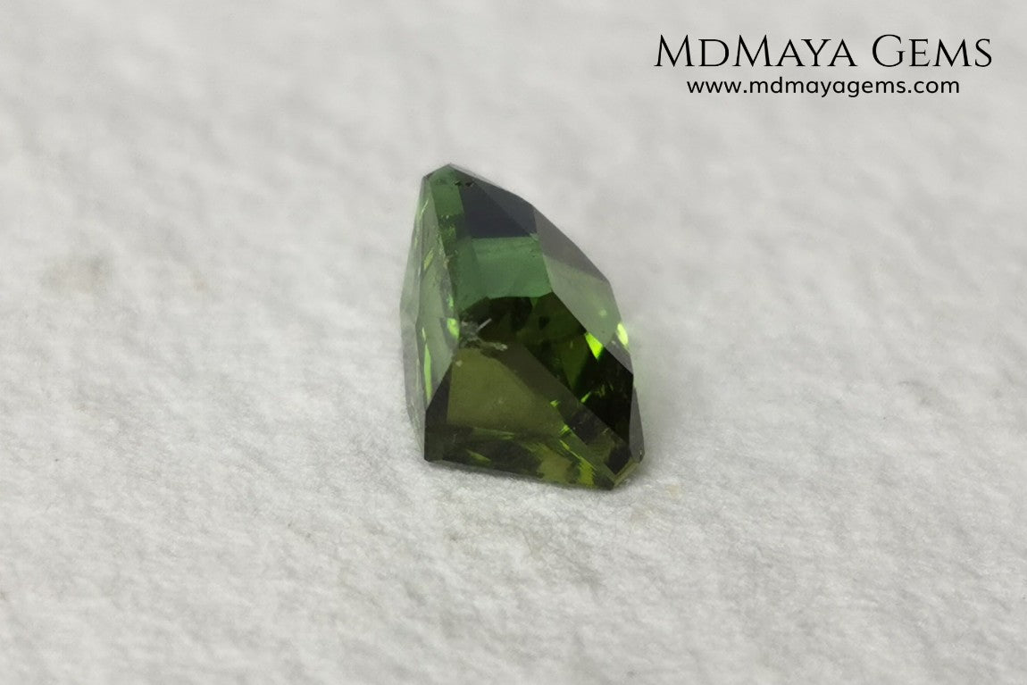 Bright Yellowish Green Tourmaline. 1.26 ct. Rectangular, scissor cut. This beautiful and natural green gemstone shows a vivid and bright color, its behavior under any kind of light is wonderful, always plenty of life and color. It will look perfect in a ring. Low price.