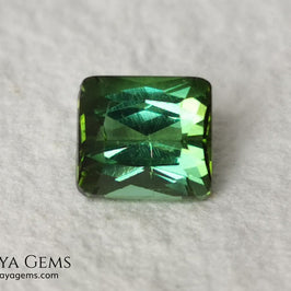 Bright Yellowish Green Tourmaline. 1.26 ct. Rectangular, scissor cut. This beautiful and natural green gemstone shows a vivid and bright color, its behavior under any kind of light is wonderful, always plenty of life and color. It will look perfect in a ring. Low price.