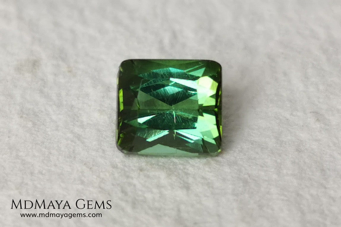 Bright Yellowish Green Tourmaline. 1.26 ct. Rectangular, scissor cut. This beautiful and natural green gemstone shows a vivid and bright color, its behavior under any kind of light is wonderful, always plenty of life and color. It will look perfect in a ring. Low price.