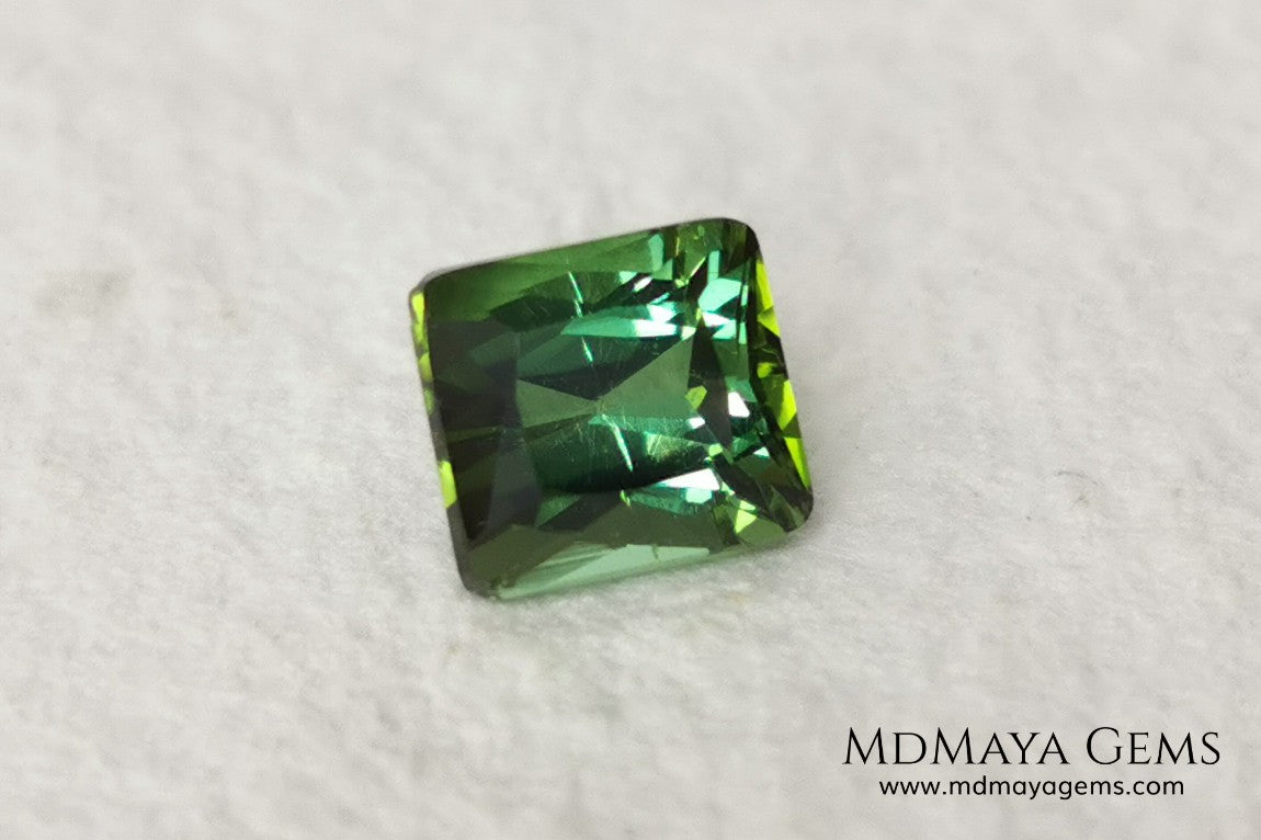 Bright Yellowish Green Tourmaline. 1.26 ct. Rectangular, scissor cut. This beautiful and natural green gemstone shows a vivid and bright color, its behavior under any kind of light is wonderful, always plenty of life and color. It will look perfect in a ring. Low price.