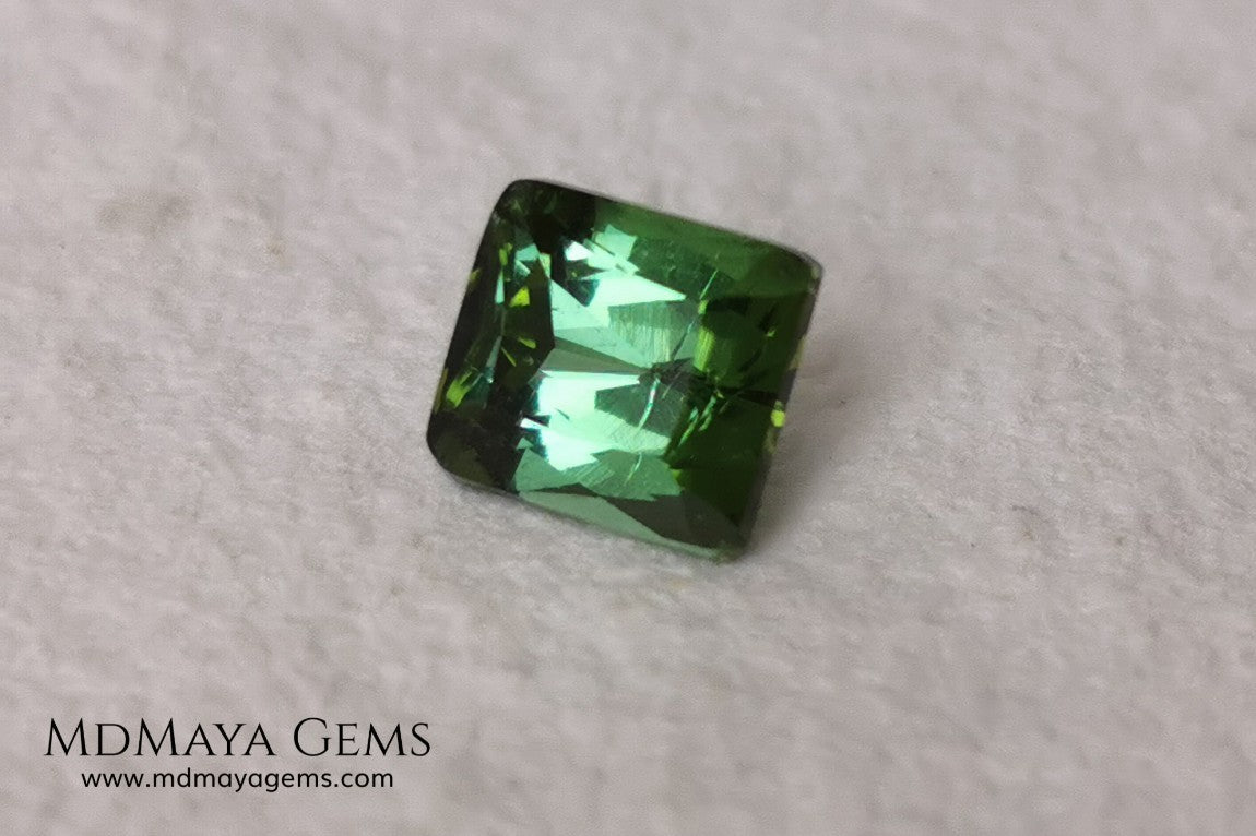 Bright Yellowish Green Tourmaline. 1.26 ct. Rectangular, scissor cut. This beautiful and natural green gemstone shows a vivid and bright color, its behavior under any kind of light is wonderful, always plenty of life and color. It will look perfect in a ring. Low price.