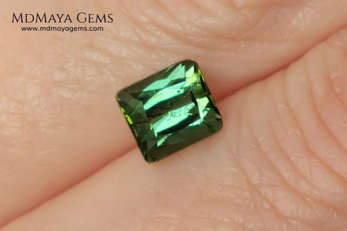 Bright Yellowish Green Tourmaline. 1.26 ct. Rectangular, scissor cut. This beautiful and natural green gemstone shows a vivid and bright color, its behavior under any kind of light is wonderful, always plenty of life and color. It will look perfect in a ring. Low price.