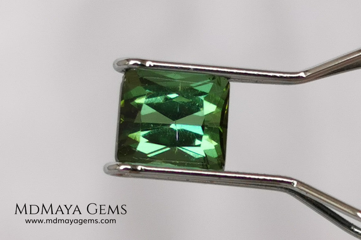Bright Yellowish Green Tourmaline. 1.26 ct. Rectangular, scissor cut. This beautiful and natural green gemstone shows a vivid and bright color, its behavior under any kind of light is wonderful, always plenty of life and color. It will look perfect in a ring. Low price.