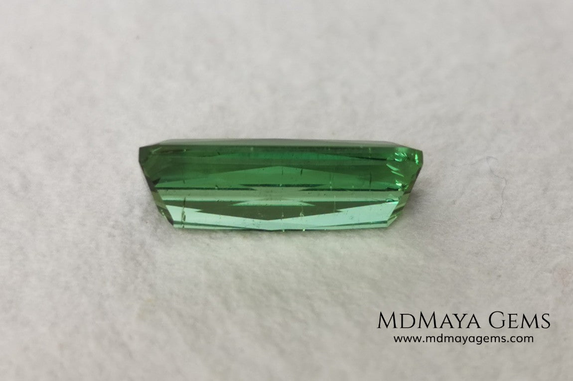 Green Tourmaline. 2.74 ct. Baguette cut. This elongated green stone shows a vivid and bright color. Its behavior under any type of light is marvelous, this pretty gem will look perfect in any kind of jewelry.