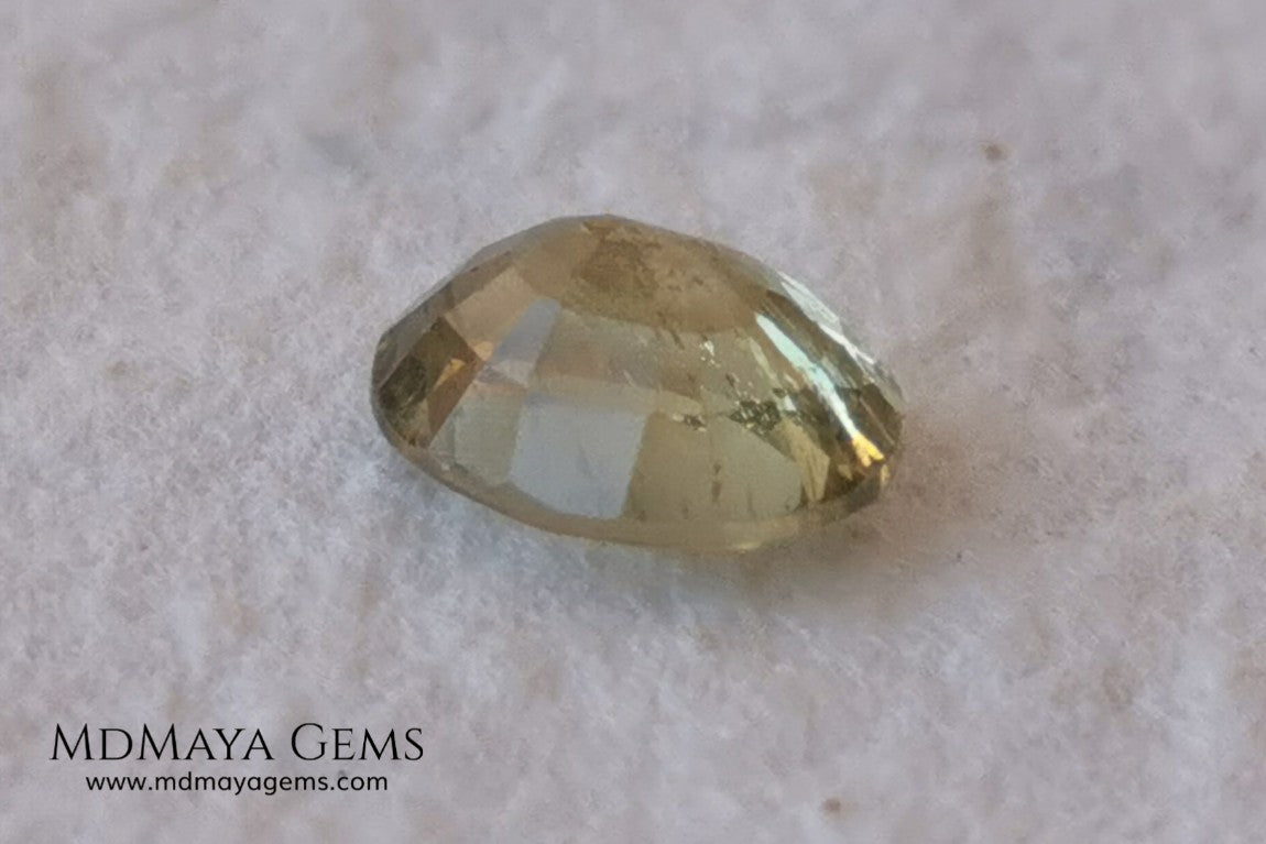  Pale Greenish Yellow Sapphire, Oval Cut. 1.12 ct. Nice unheated gemstone at an affordable price. It will very pretty in any kind of jewelry.