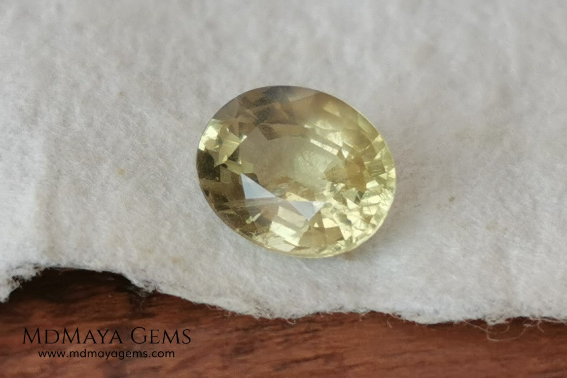 Pale Greenish Yellow Sapphire, Oval Cut. 1.12 ct. Nice unheated gemstone at an affordable price. It will very pretty in any kind of jewelry.