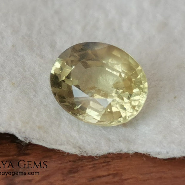  Pale Greenish Yellow Sapphire, Oval Cut. 1.12 ct. Nice unheated gemstone at an affordable price. It will very pretty in any kind of jewelry.