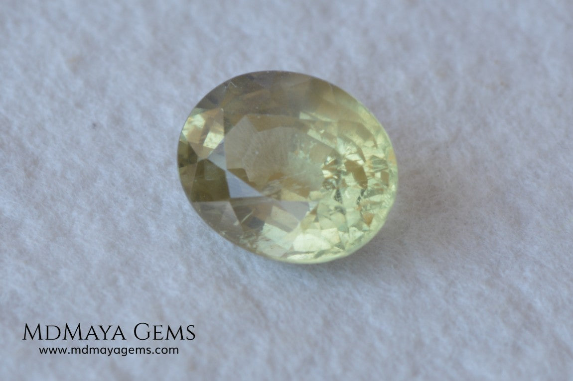  Pale Greenish Yellow Sapphire, Oval Cut. 1.12 ct. Nice unheated gemstone at an affordable price. It will very pretty in any kind of jewelry.