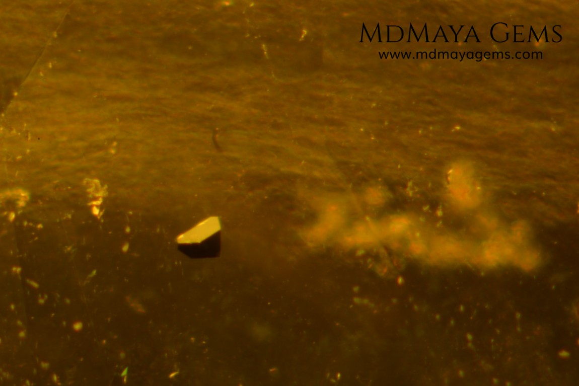 inclusions in idocrase 7.04 ct oval cut