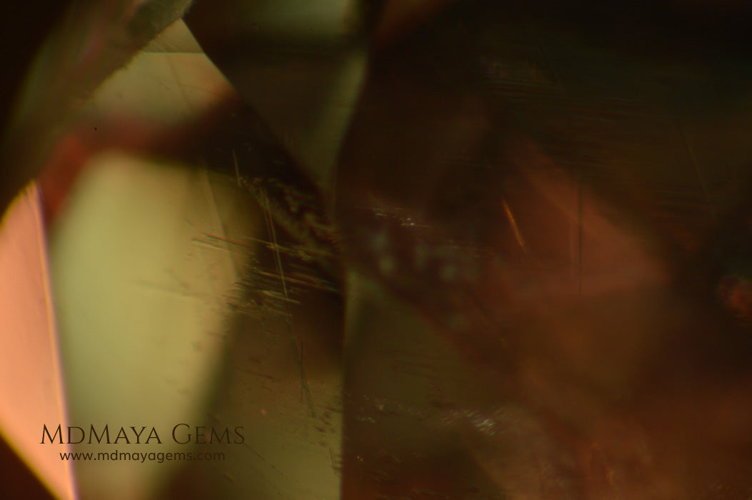 Color Change Diaspore Gemstone 12.03 ct under different lighting conditions