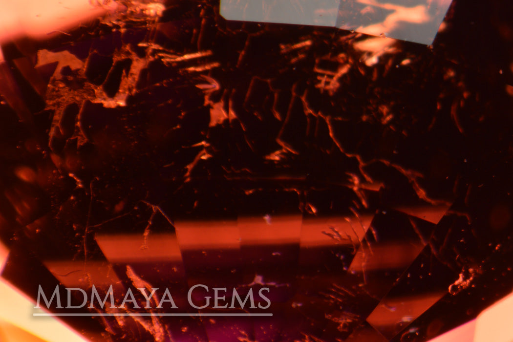 Inclusions in Dark Reddish Purple Tourmaline. Oval Cut. 5.51ct.