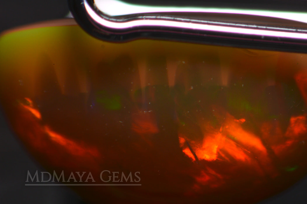 This Welo Opal 1.66  ct shows an interesting honeycomb pattern by one side under microscope