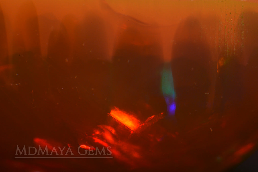 This Welo Opal 1.66  ct shows an interesting honeycomb pattern by one side under microscope