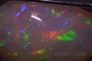 Elegant light crystal Welo opal 2.77 ct with firework pattern under microscope