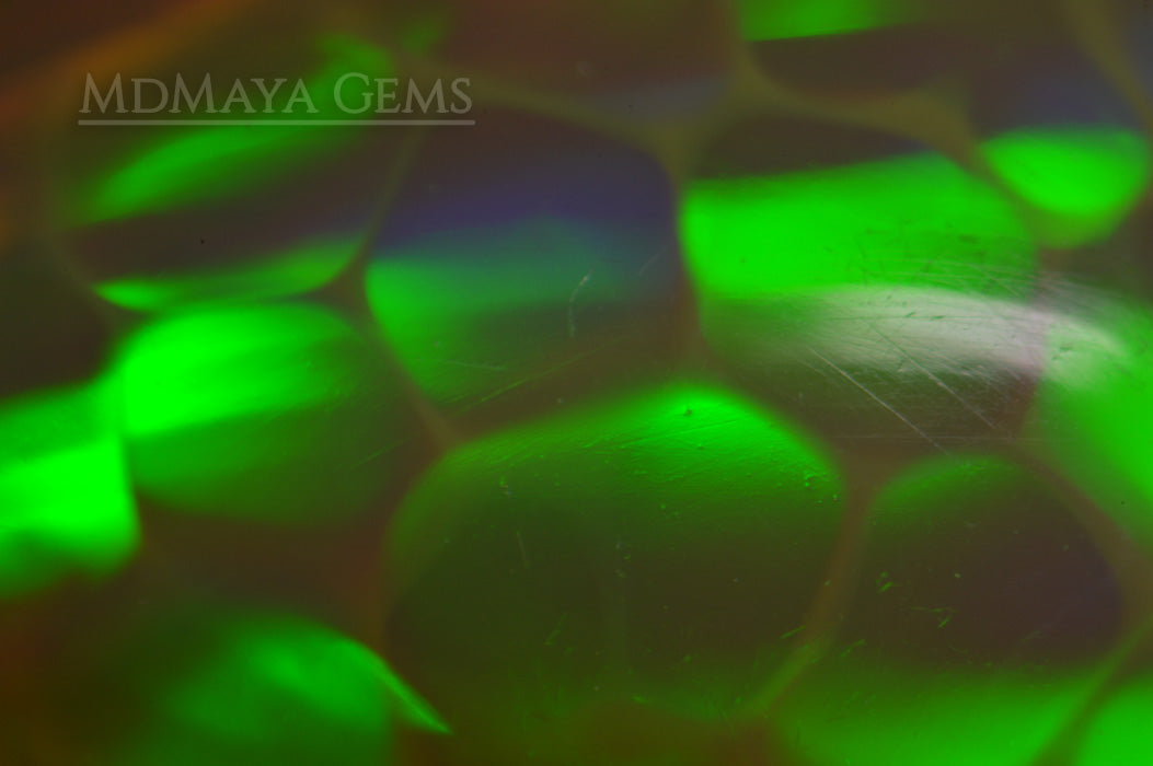 Super HoneyComb Opal from Ethiopia 4.47 ct. Pear Cabochon Cut under microscope