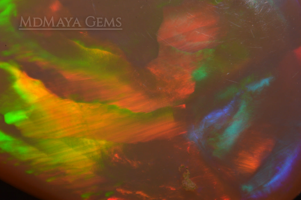 Super HoneyComb Opal from Ethiopia 4.47 ct. Pear Cabochon Cut under microscope