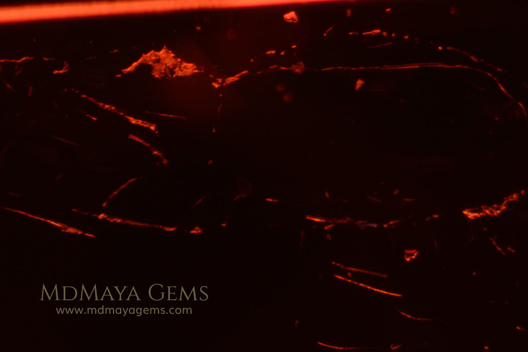 Inclusions in Dark Orangy Red Tourmaline Oval Cut 9.33 ct