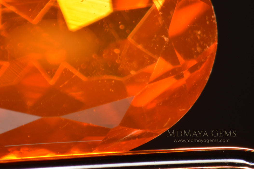 Inclusions in Charismatic Mexican Fire Opal. Oval cut. 2.04 ct.
