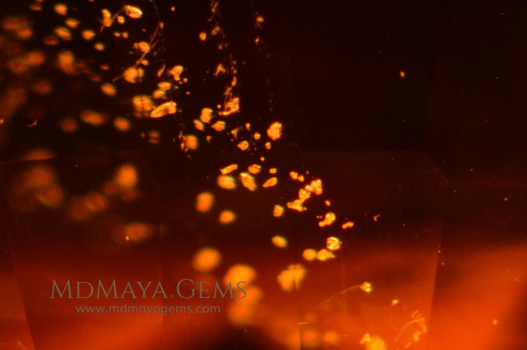 Inclusions in Rare Orange Clinohumite Gemstone