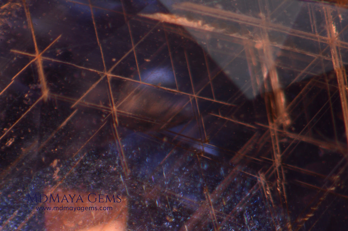 inclusions in untreated sapphire, probably boehmite needles