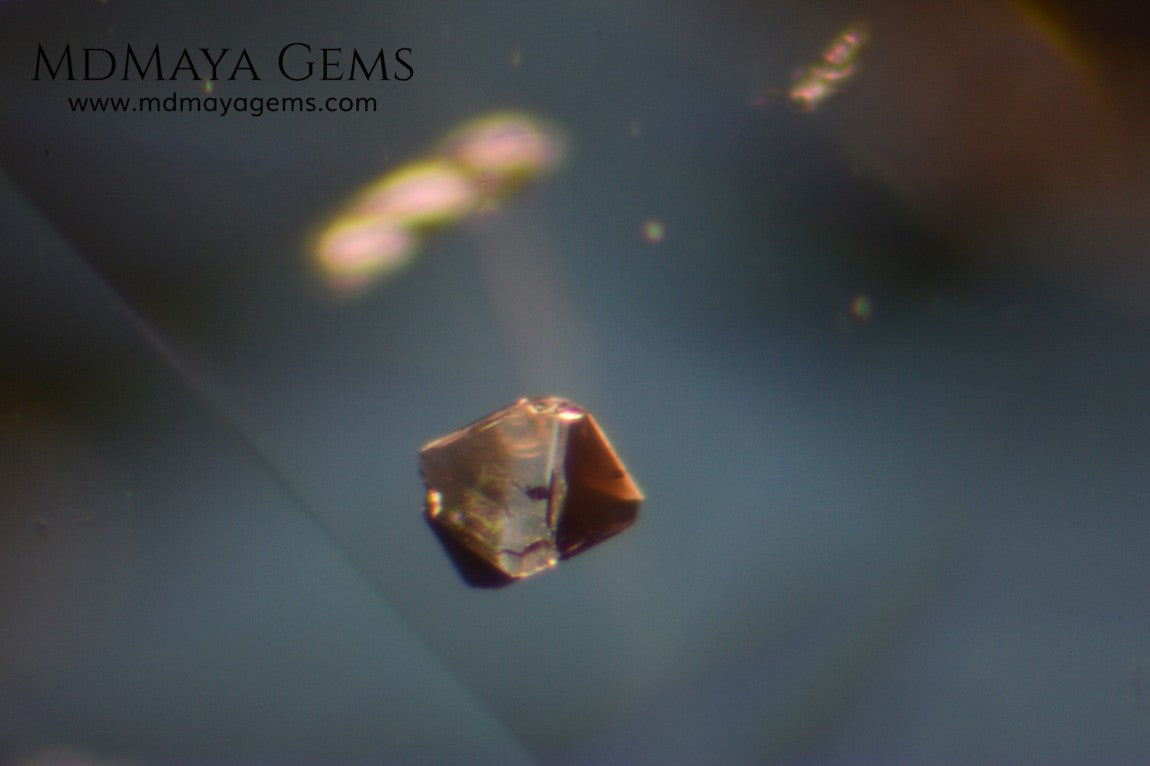 inclusions in untreated greenish gray spinel, 3.13 ct