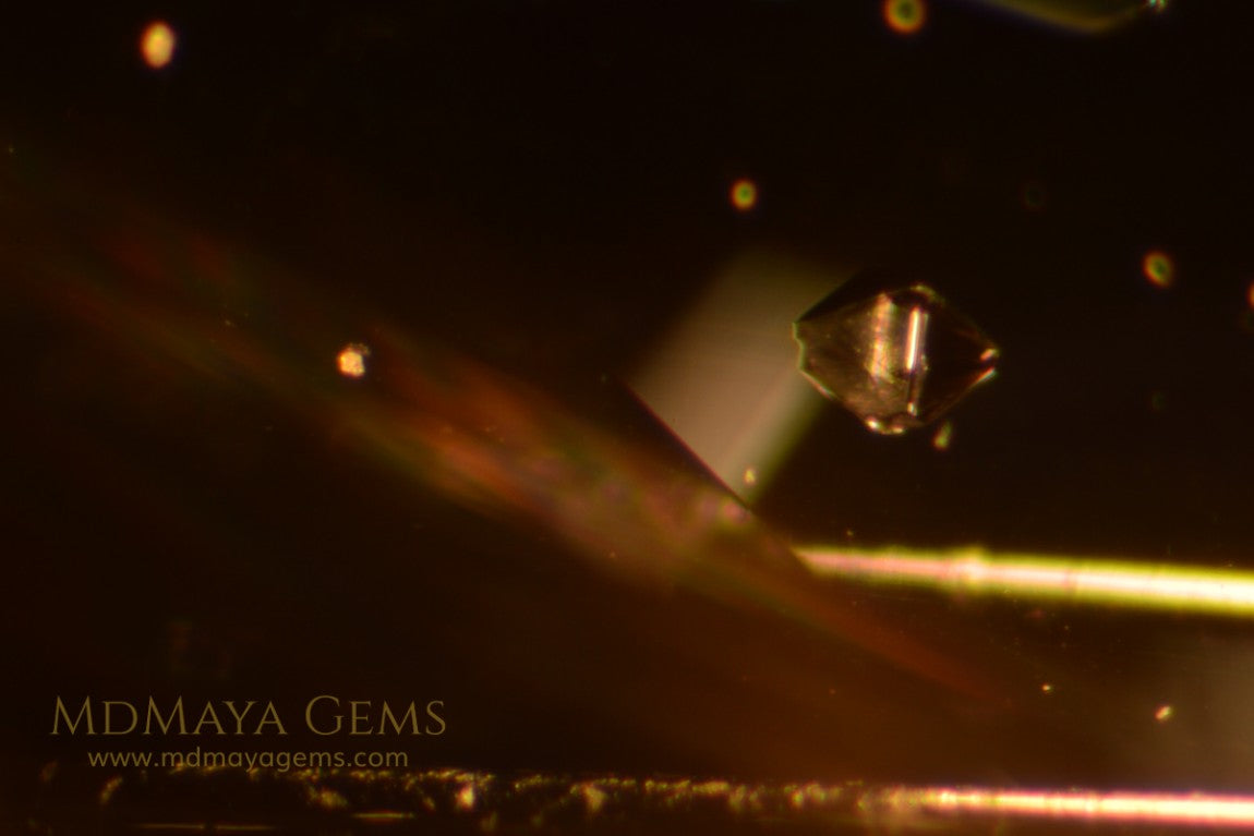 inclusions in untreated greenish gray spinel, 3.13 ct