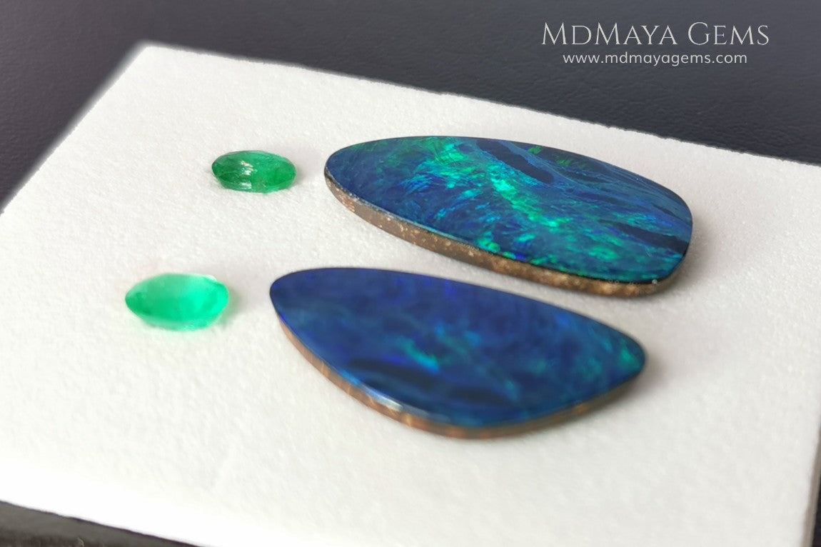  Opal Doublets and Emeralds. This set is composed by a pair of bright Australian Opal doublet and two vivid Zambian Emeralds. The perfect combination for your bespoke jewelry.