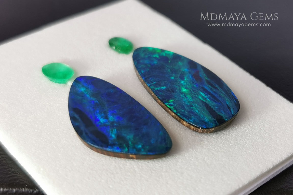  Opal Doublets and Emeralds. This set is composed by a pair of bright Australian Opal doublet and two vivid Zambian Emeralds. The perfect combination for your bespoke jewelry.