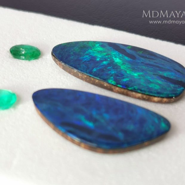  Opal Doublets and Emeralds. This set is composed by a pair of bright Australian Opal doublet and two vivid Zambian Emeralds. The perfect combination for your bespoke jewelry.