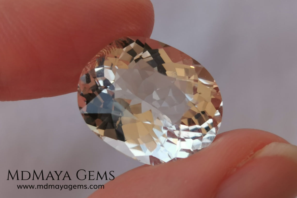 Light Peach Morganite. Oval Cut. 11.98 ct.  This morganite has a very light pale peach color, it is a natural gem of large size, beautiful proportions and great brilliance, it has a small fracture in the pavilion, but that does not affect the beauty of the gem. Once mounted on any piece of jewelry it will be spectacular and the best price. A great gem within the reach of any pocket.