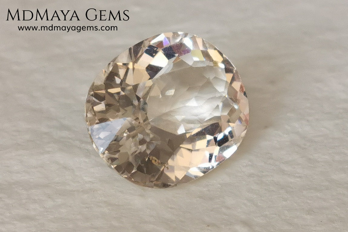 Light Peach Morganite. Oval Cut. 11.98 ct.  This morganite has a very light pale peach color, it is a natural gem of large size, beautiful proportions and great brilliance, it has a small fracture in the pavilion, but that does not affect the beauty of the gem. Once mounted on any piece of jewelry it will be spectacular and the best price. A great gem within the reach of any pocket.