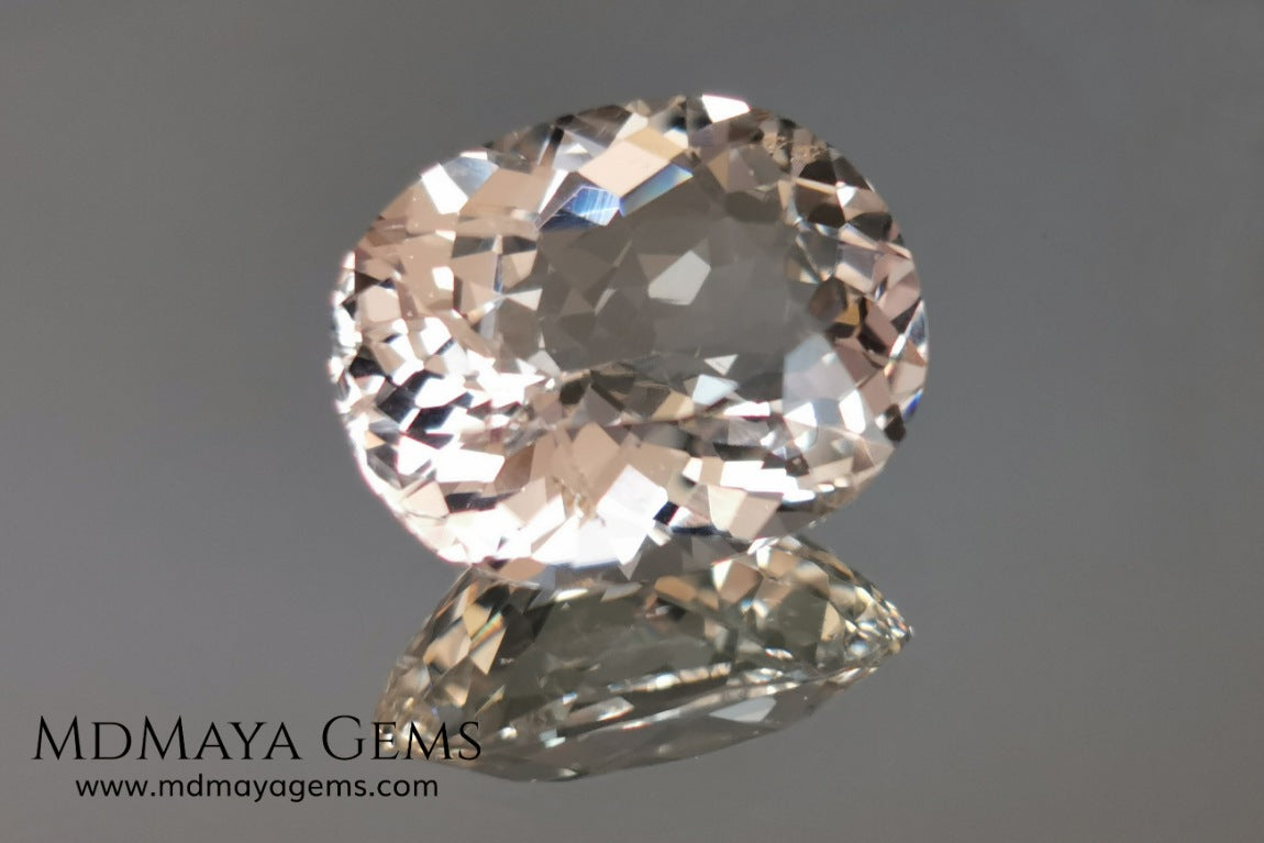Light Peach Morganite. Oval Cut. 11.98 ct.  This morganite has a very light pale peach color, it is a natural gem of large size, beautiful proportions and great brilliance, it has a small fracture in the pavilion, but that does not affect the beauty of the gem. Once mounted on any piece of jewelry it will be spectacular and the best price. A great gem within the reach of any pocket.